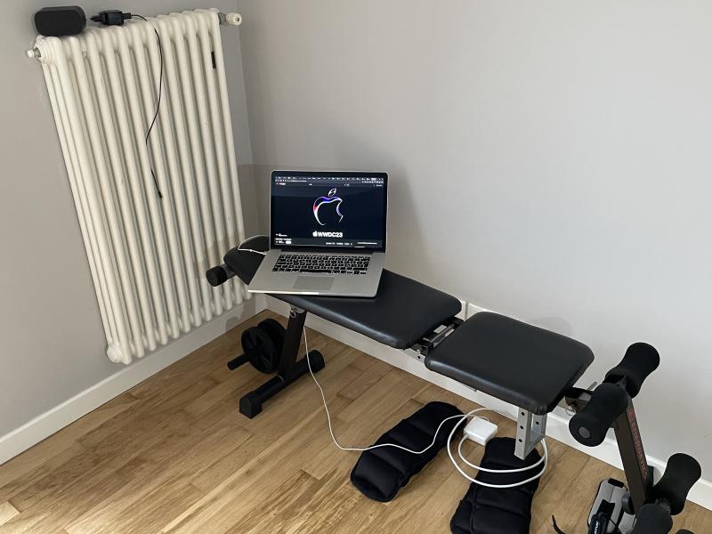 MacBook on a gym bench